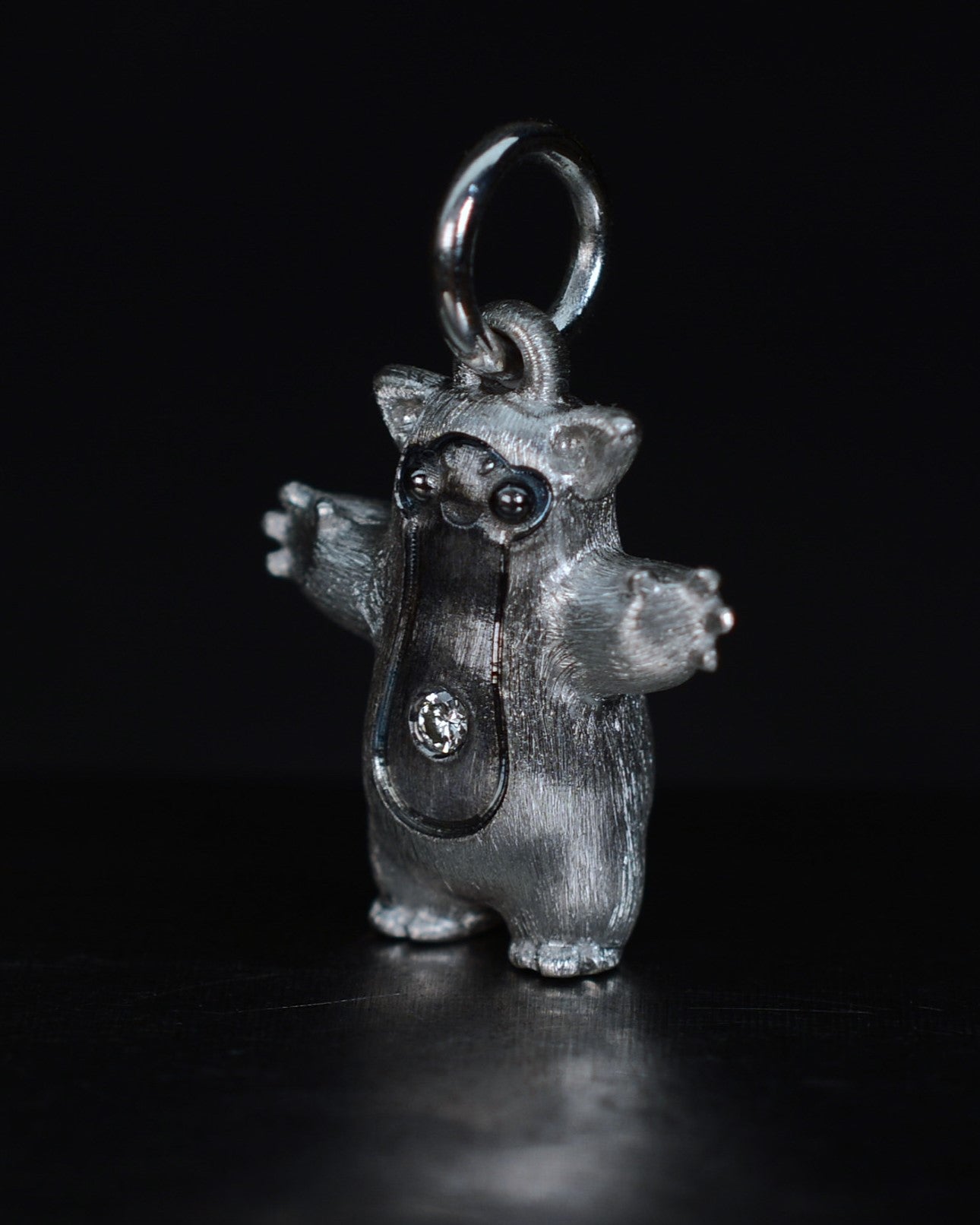 Fox eared pearshape small Bright Creature with a diamond and black rhodium.