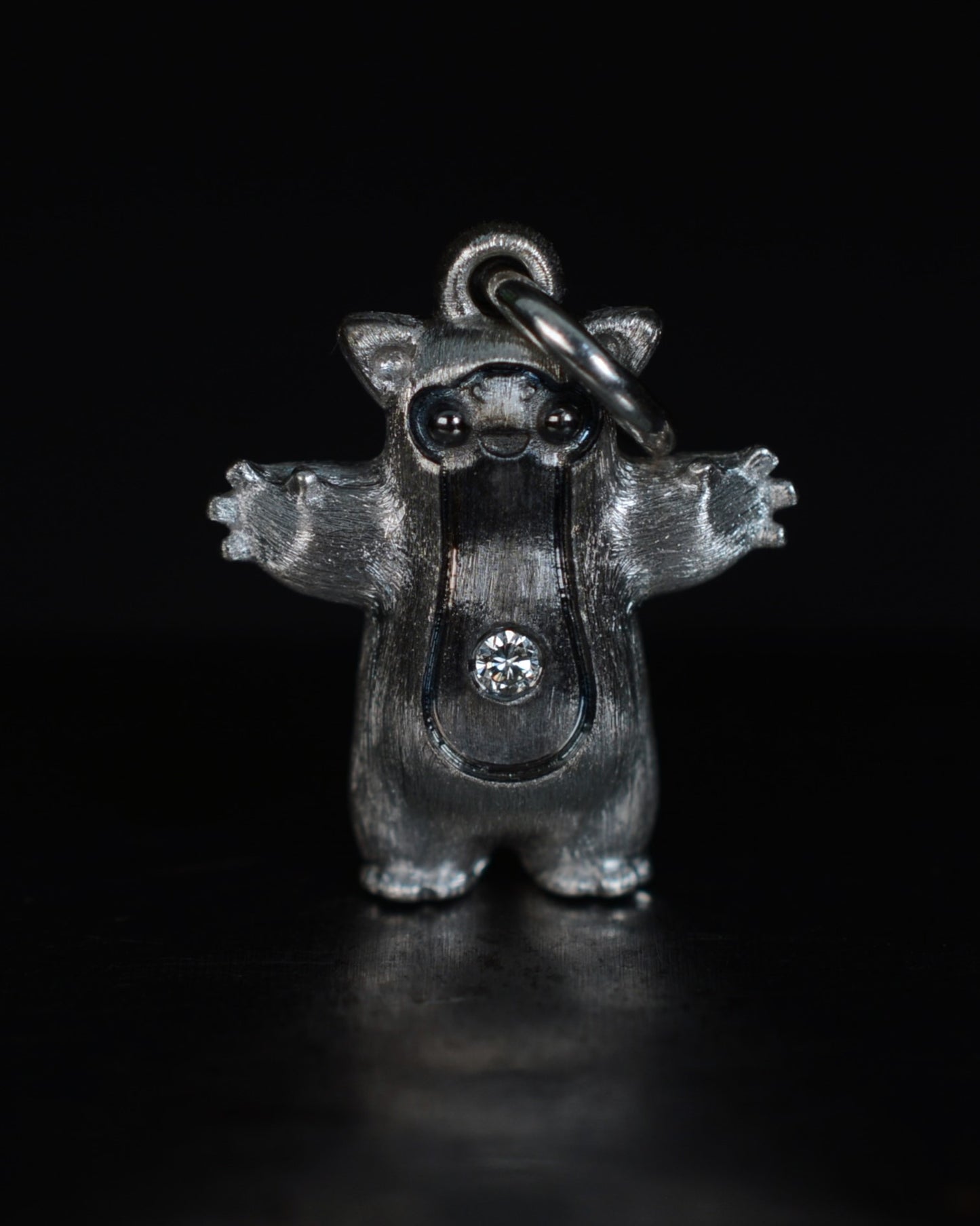 Fox eared pearshape small Bright Creature with a diamond and black rhodium.
