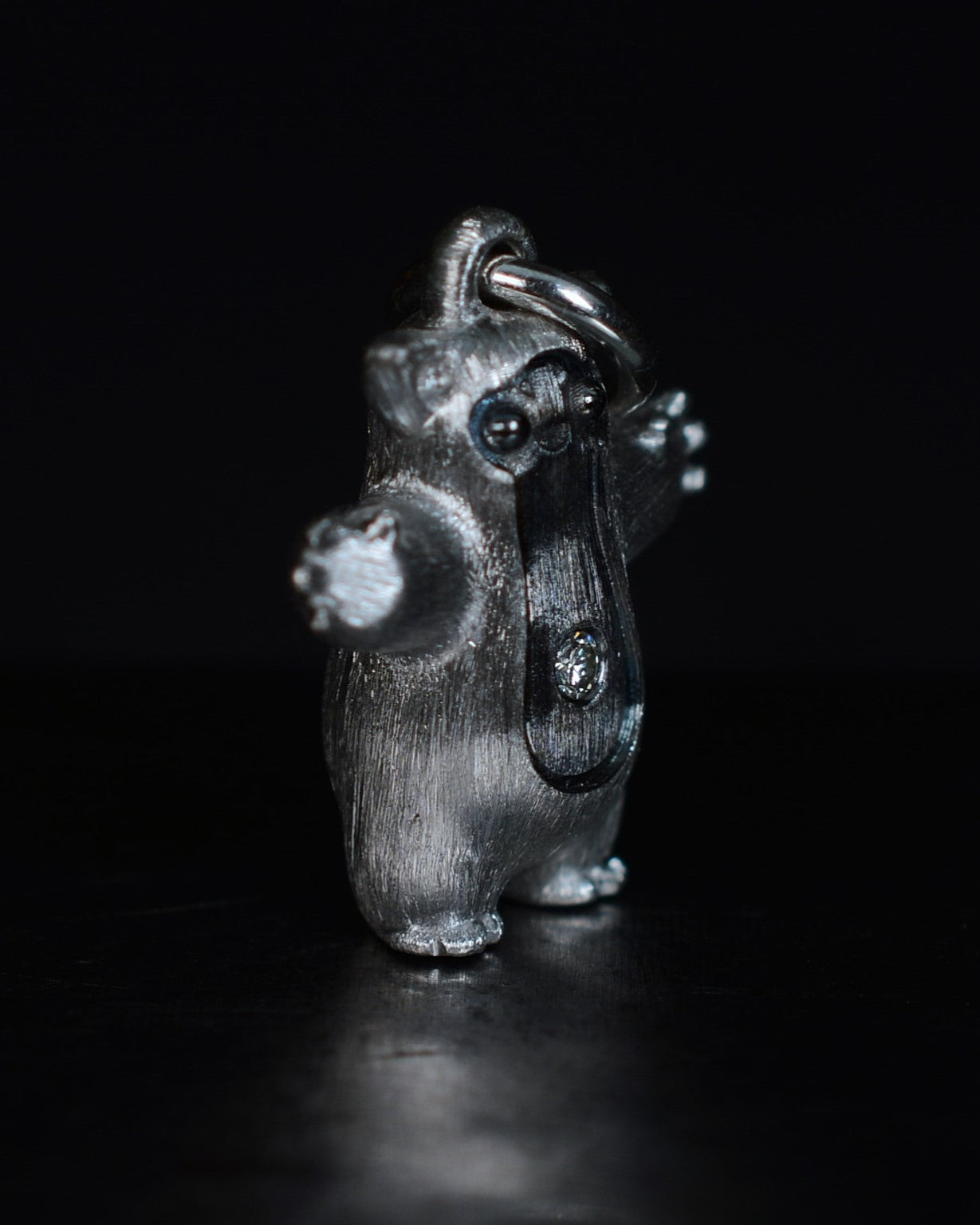 Fox eared pearshape small Bright Creature with a diamond and black rhodium.