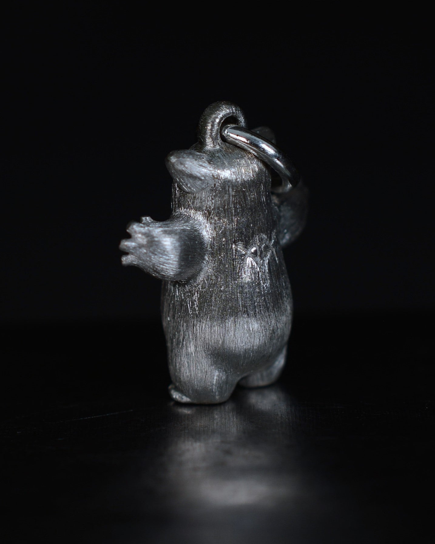 Fox eared pearshape small Bright Creature with a diamond and black rhodium.