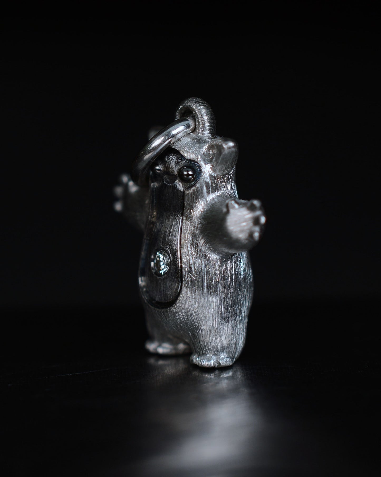 Fox eared pearshape small Bright Creature with a diamond and black rhodium.