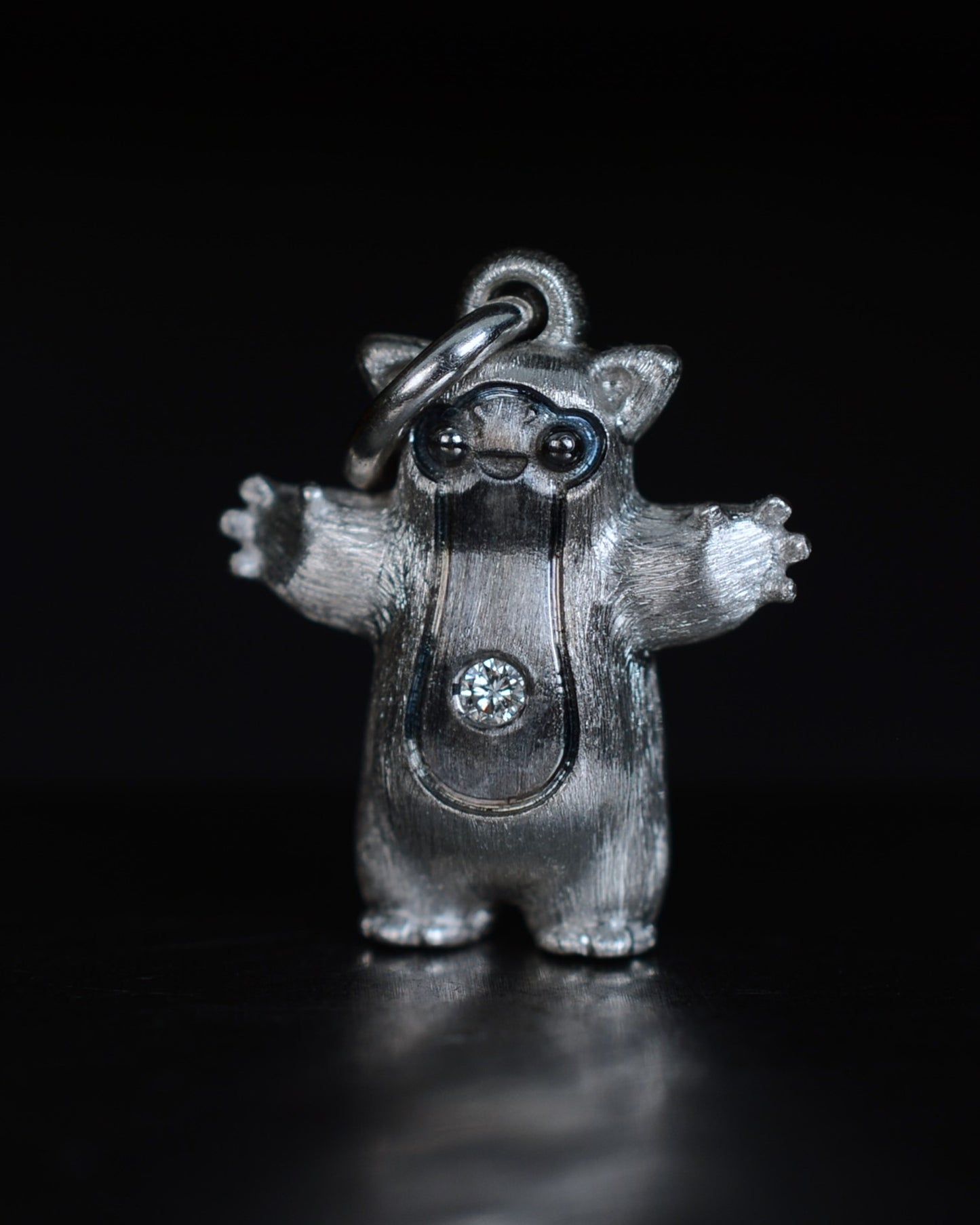 Fox eared pearshape small Bright Creature with a diamond and black rhodium.