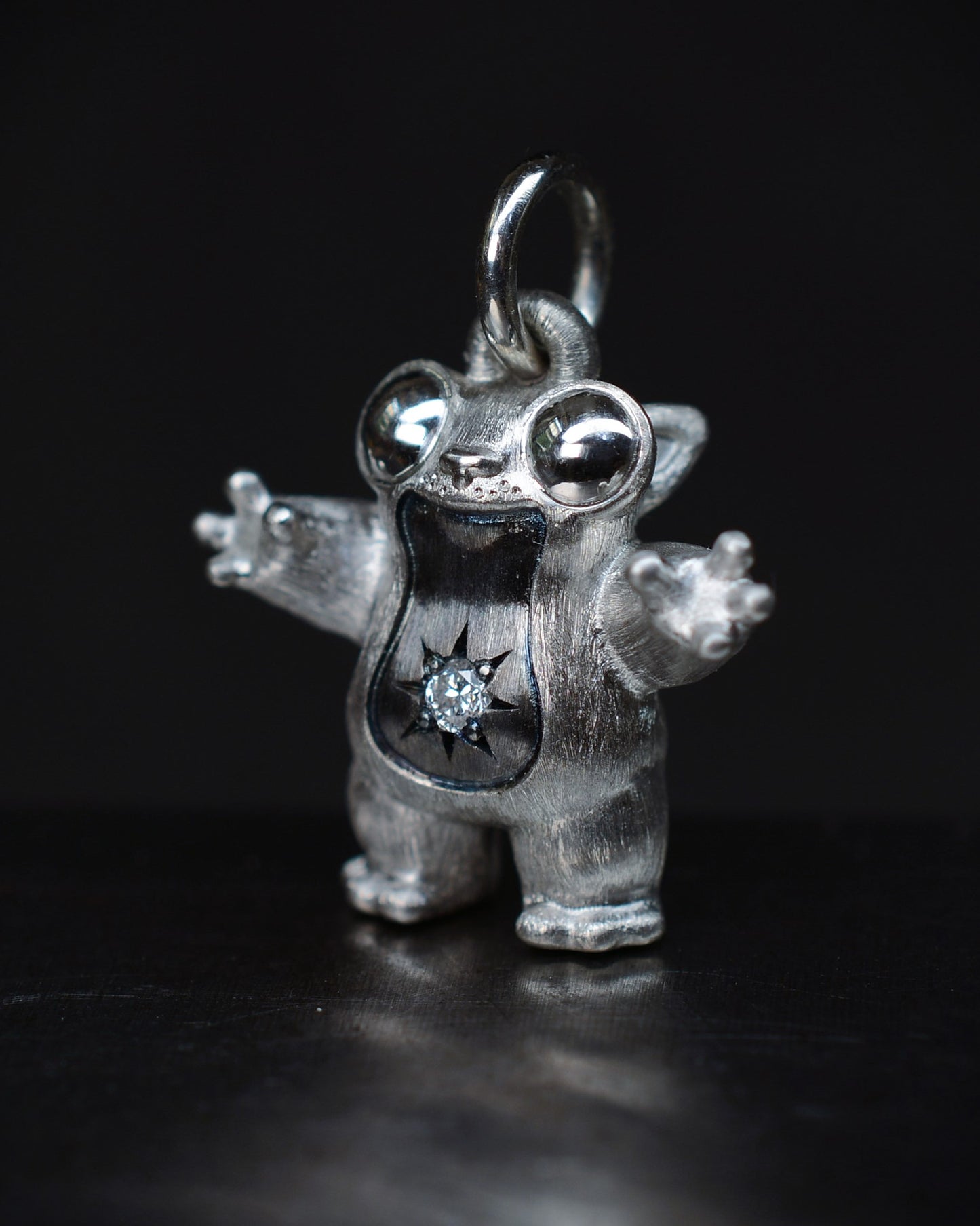 Black Star tarsier type Bright Creature with a diamond and black rhodium.