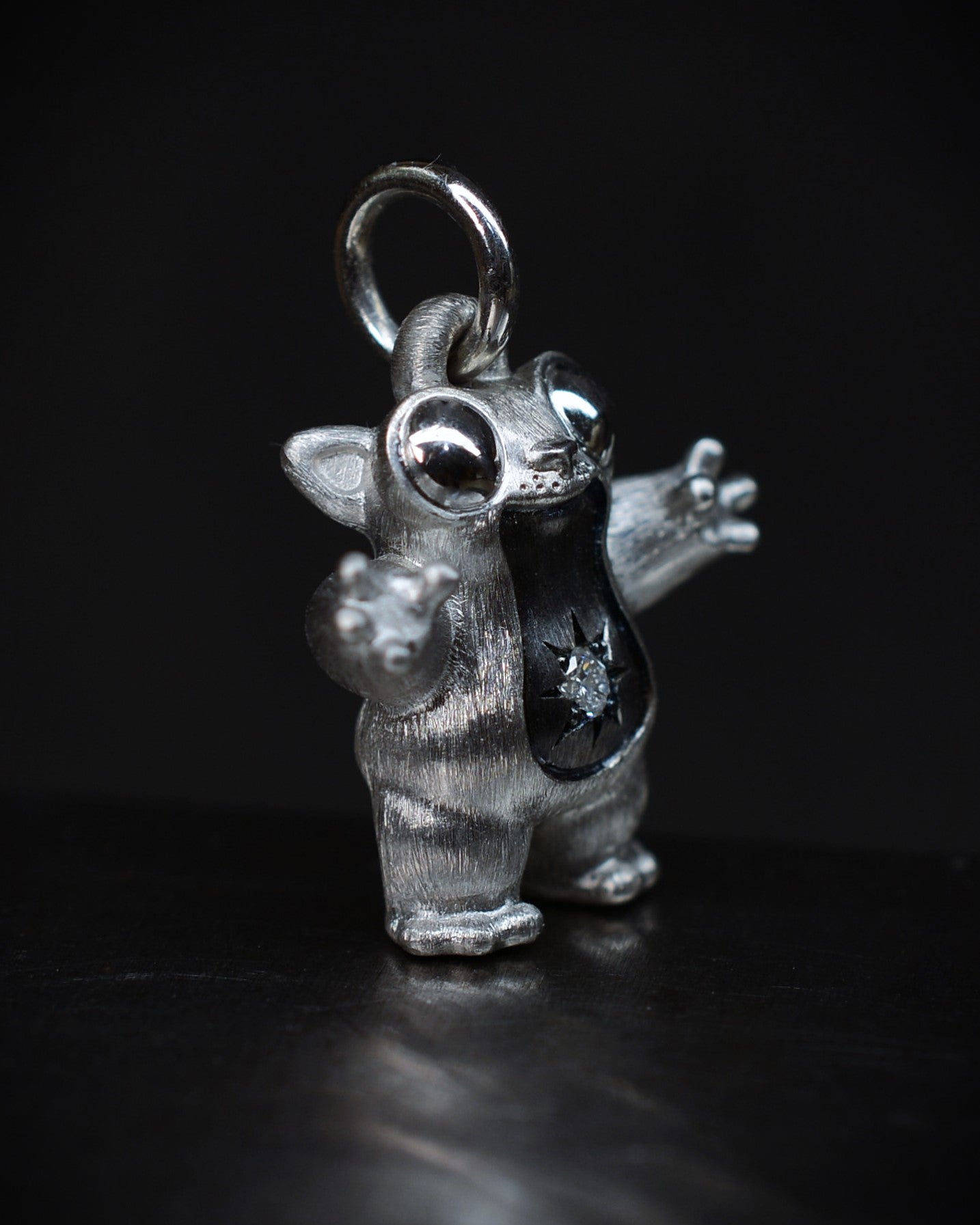 Black Star tarsier type Bright Creature with a diamond and black rhodium.