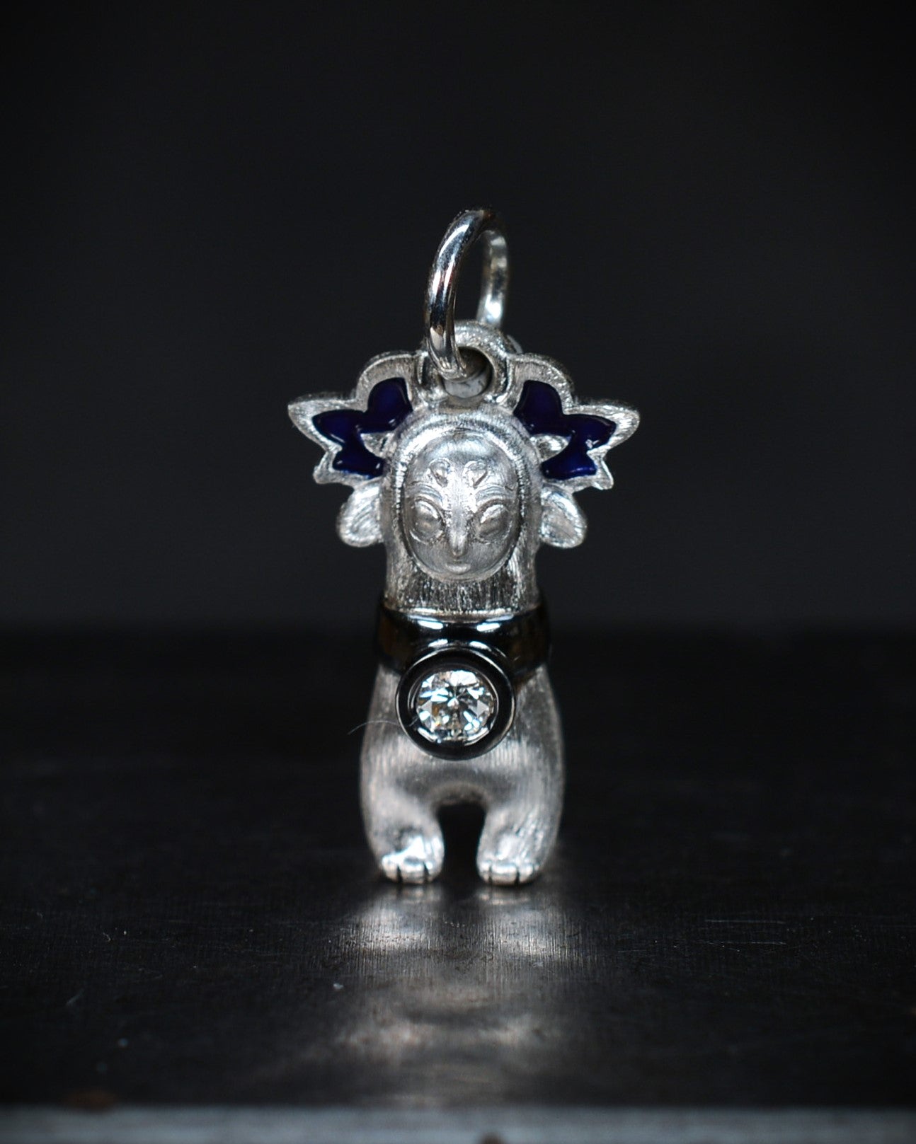 Bright Creature with blue antlers and a diamond and black rhodium collar.