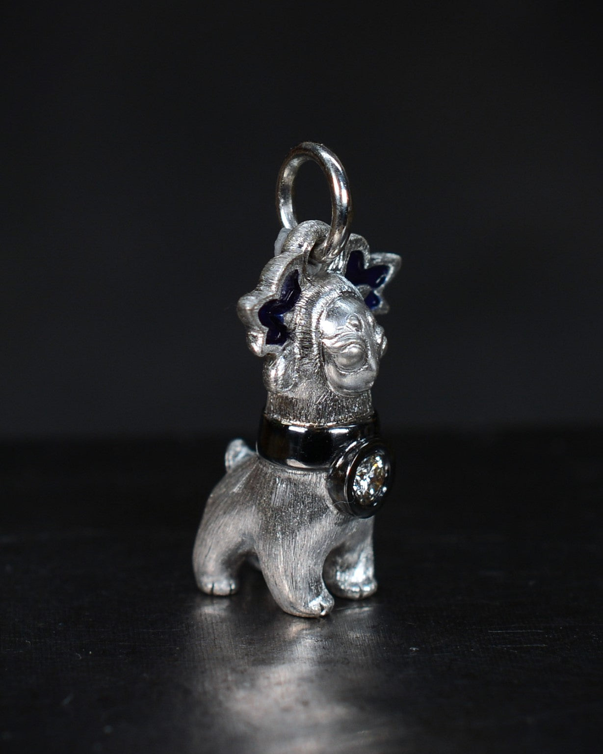 Bright Creature with blue antlers and a diamond and black rhodium collar.