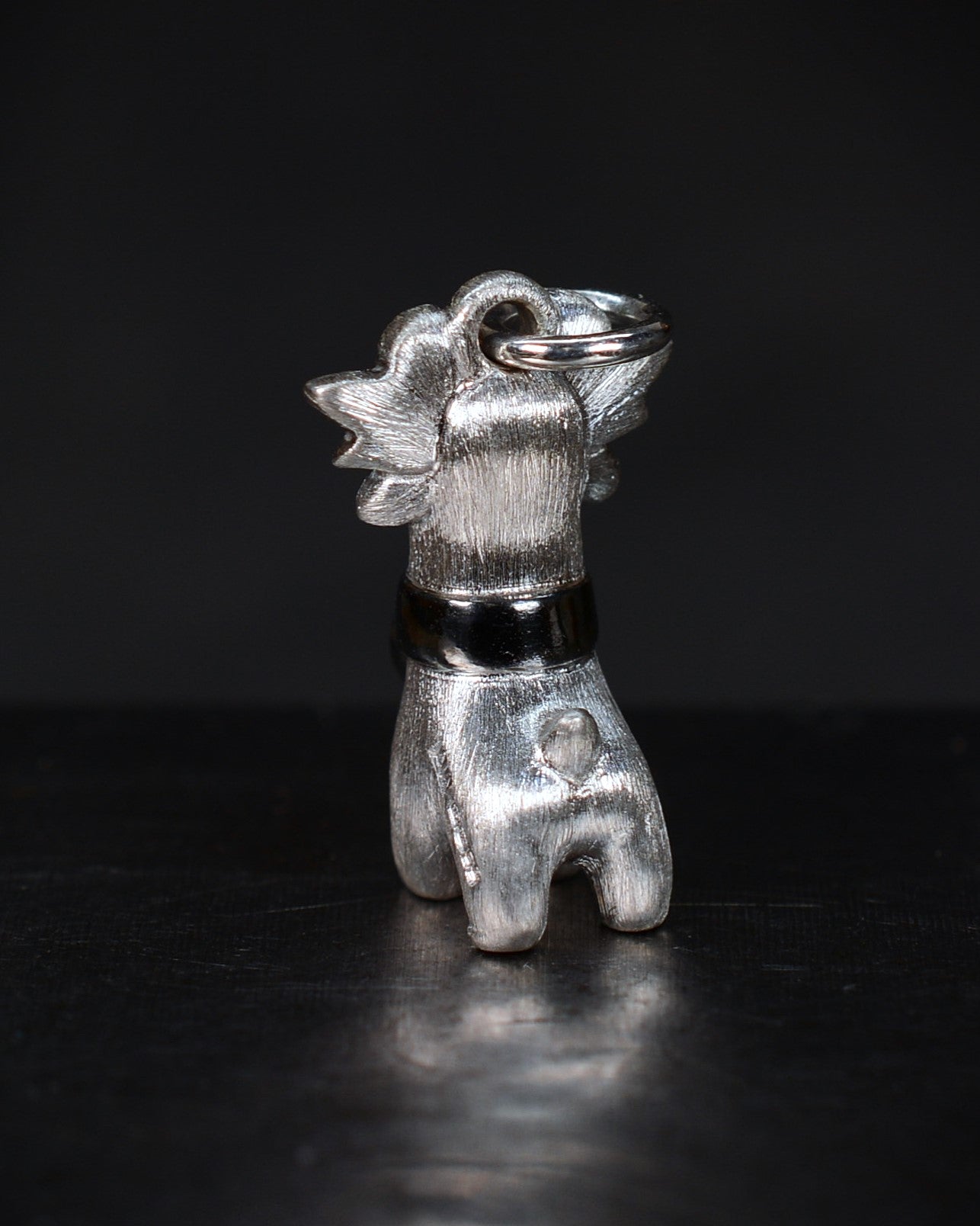Bright Creature with blue antlers and a diamond and black rhodium collar.