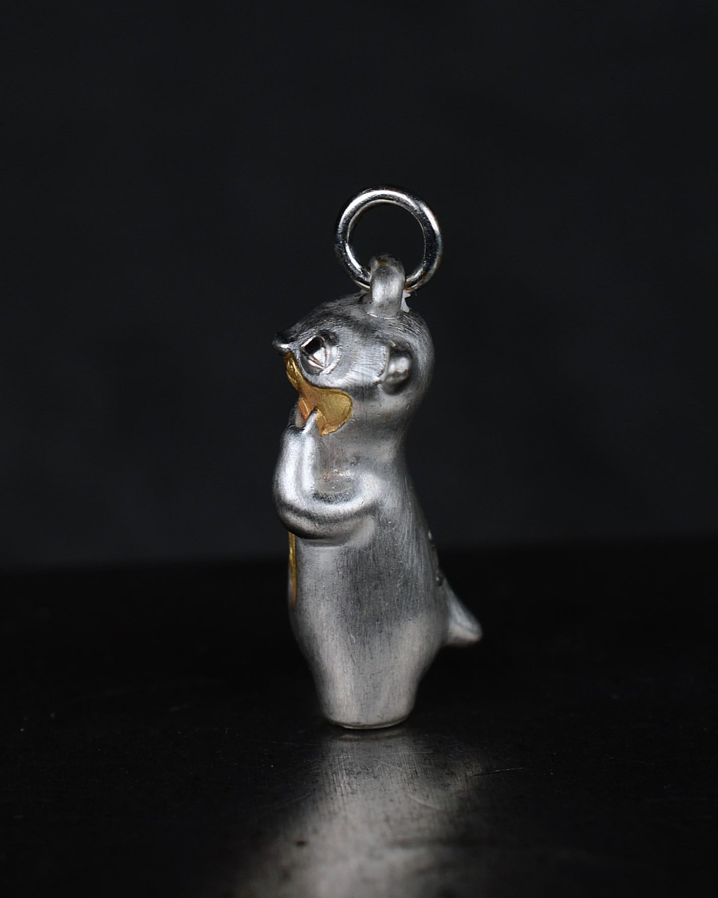 Contemplative Stoat type Bright Creature with a diamond and parcel gilt.