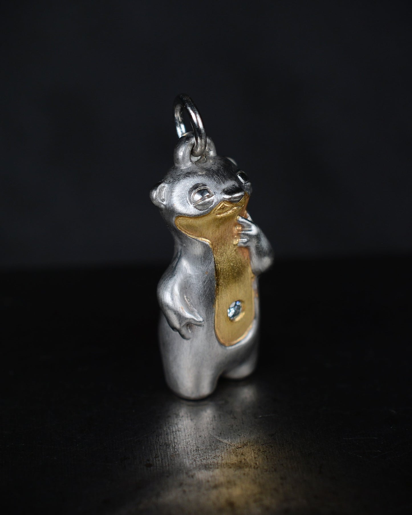 Contemplative Stoat type Bright Creature with a diamond and parcel gilt.