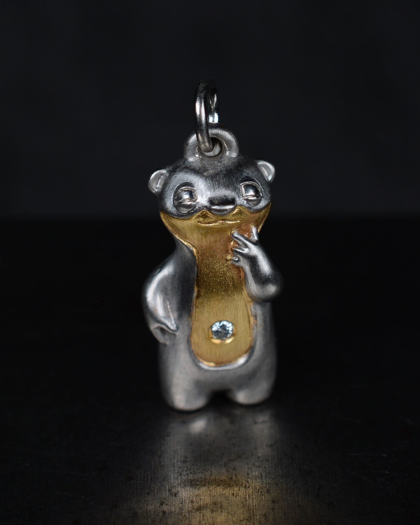 Contemplative Stoat type Bright Creature with a diamond and parcel gilt.