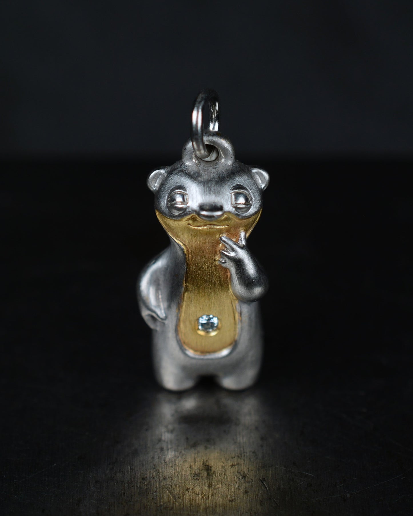 Contemplative Stoat type Bright Creature with a diamond and parcel gilt.