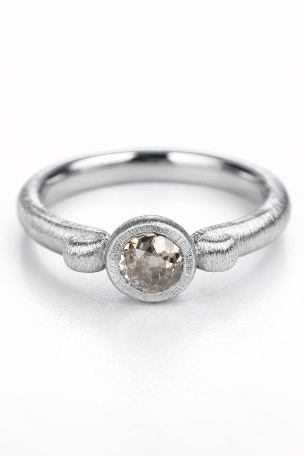 Old-cut diamond ring featuring a 0.64ct natural diamond reclaimed from vintage jewellery.