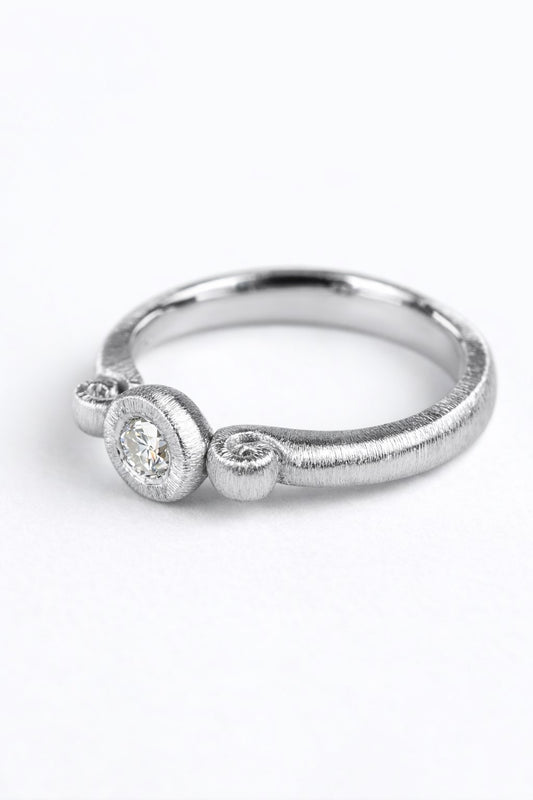Diamond ring featuring a 0.15ct natural diamond reclaimed from vintage jewellery.