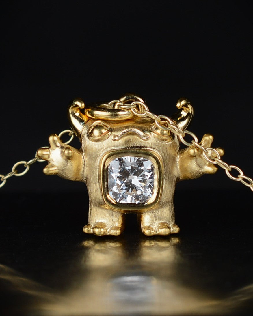Gold Cushion Creature and gold chain, Bright Creature set with a natural cushion-cut diamond.