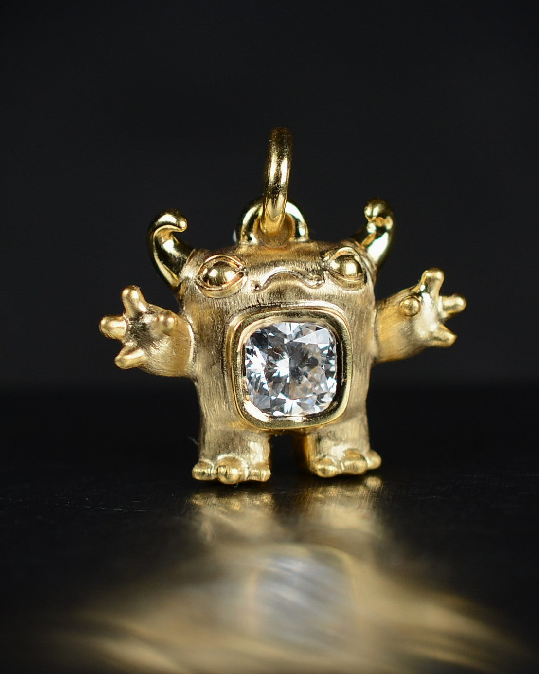 Gold Cushion Creature and gold chain, Bright Creature set with a natural cushion-cut diamond.