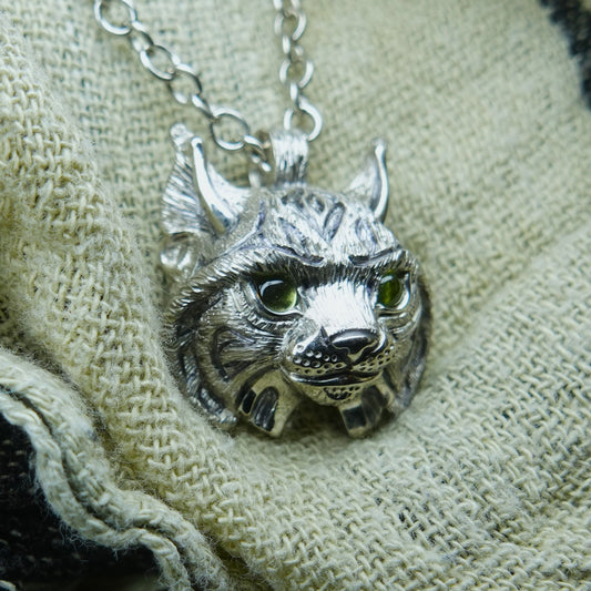 Small Lynx Necklace. Platinum plated sterling silver lynx head pendant with peridot eyes & solid silver chain. *This piece is finished and ready to be shipped* © Adrian Ashley