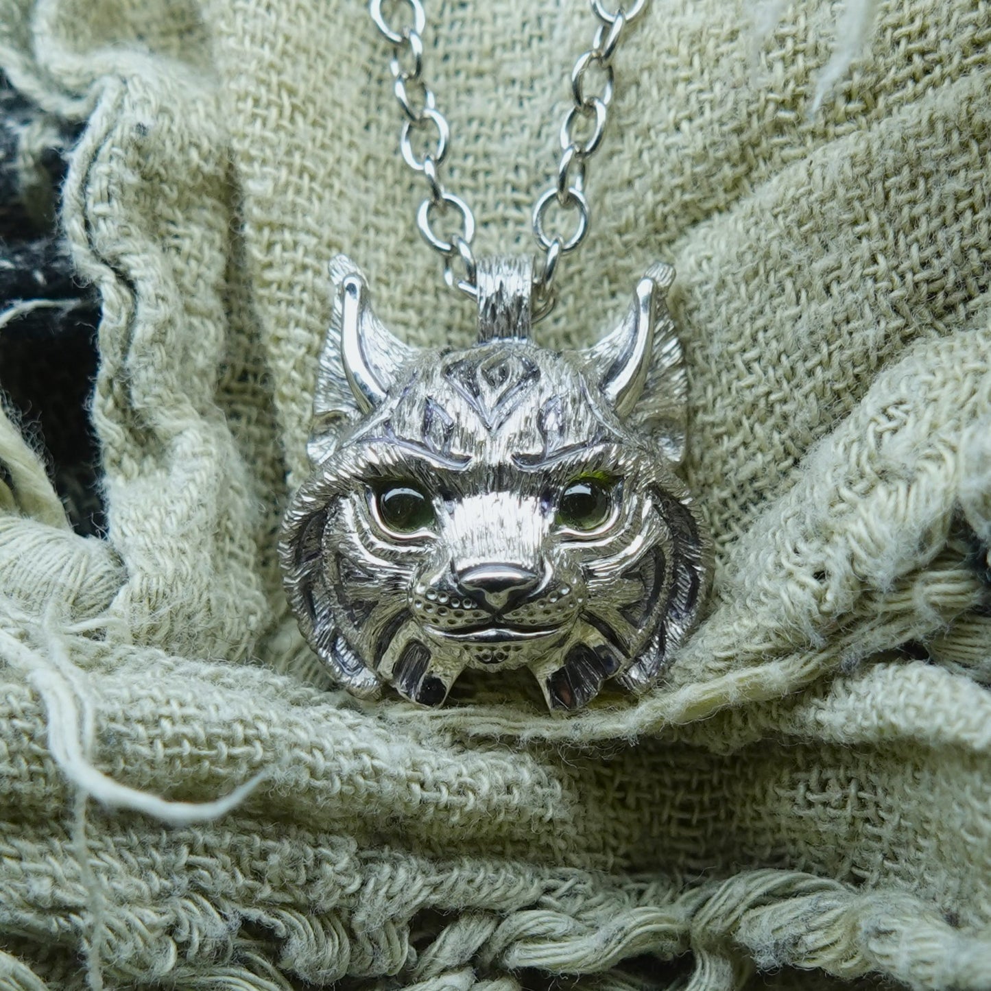 Small Lynx Necklace. Platinum plated sterling silver lynx head pendant with peridot eyes & solid silver chain. *This piece is finished and ready to be shipped* © Adrian Ashley