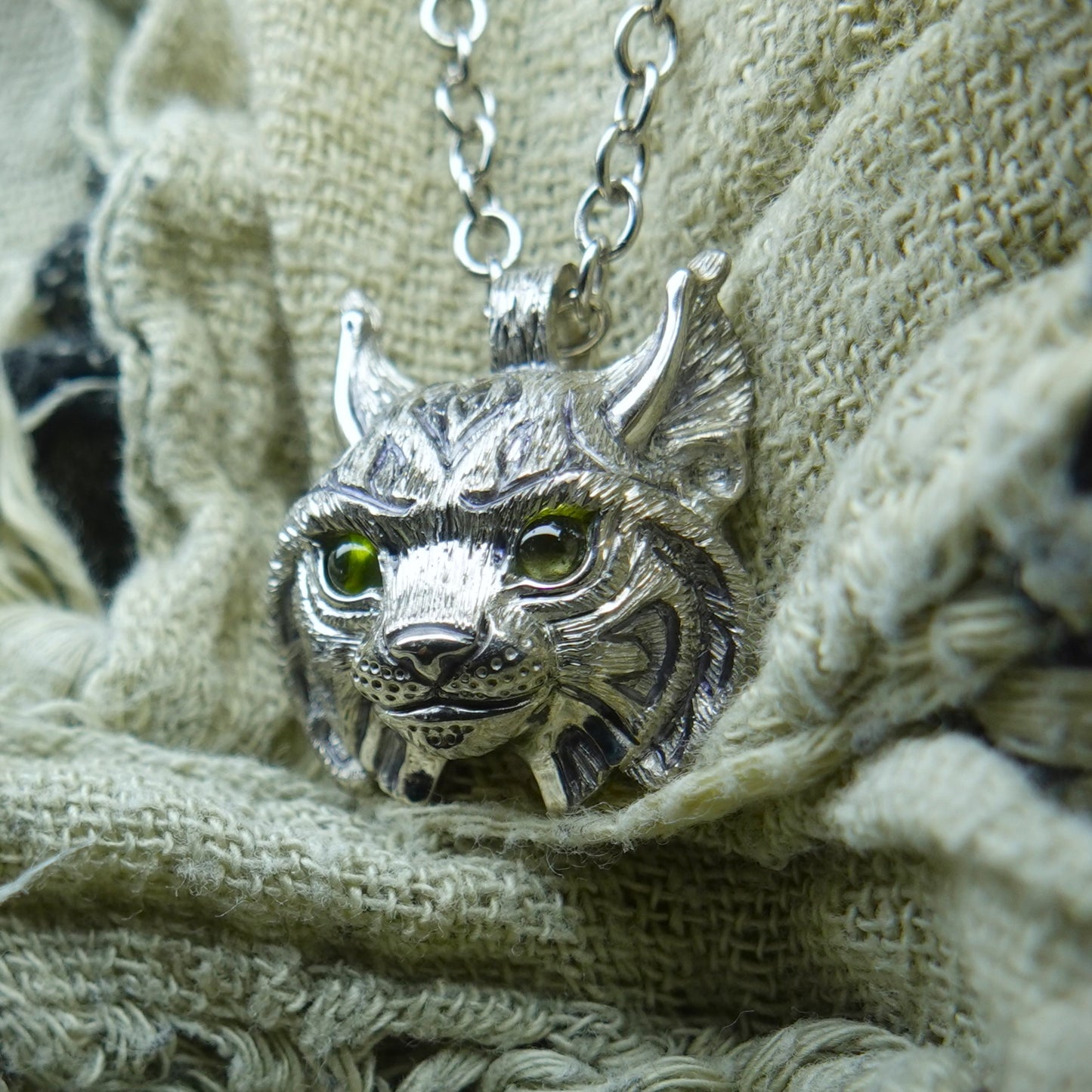 Small Lynx Necklace. Platinum plated sterling silver lynx head pendant with peridot eyes & solid silver chain. *This piece is finished and ready to be shipped* © Adrian Ashley