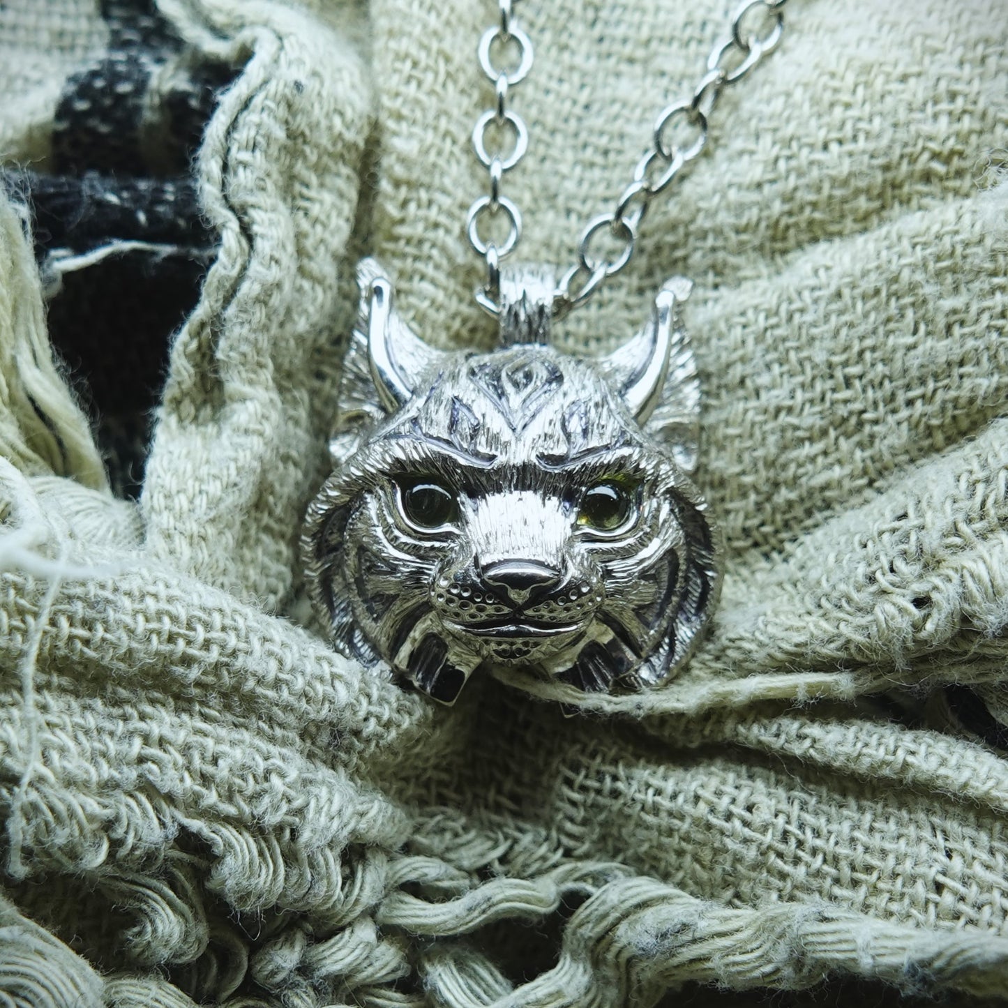 Small Lynx Necklace. Platinum plated sterling silver lynx head pendant with peridot eyes & solid silver chain. *This piece is finished and ready to be shipped* © Adrian Ashley