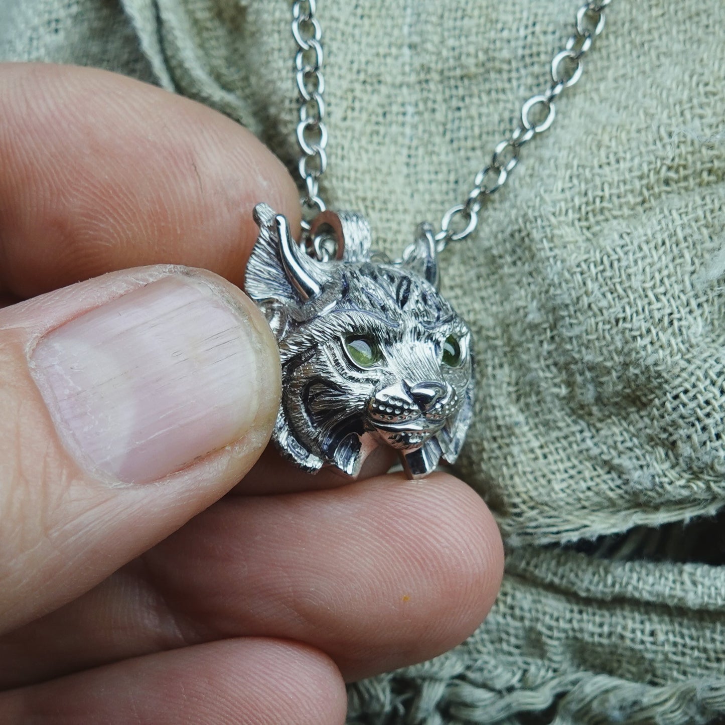 Small Lynx Necklace. Platinum plated sterling silver lynx head pendant with peridot eyes & solid silver chain. *This piece is finished and ready to be shipped* © Adrian Ashley