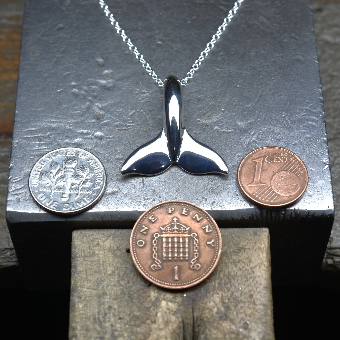 Classic whale tail necklace. Made from highly polished, tarnish resistant silver, hung on a solid silver chain. © Adrian Ashley