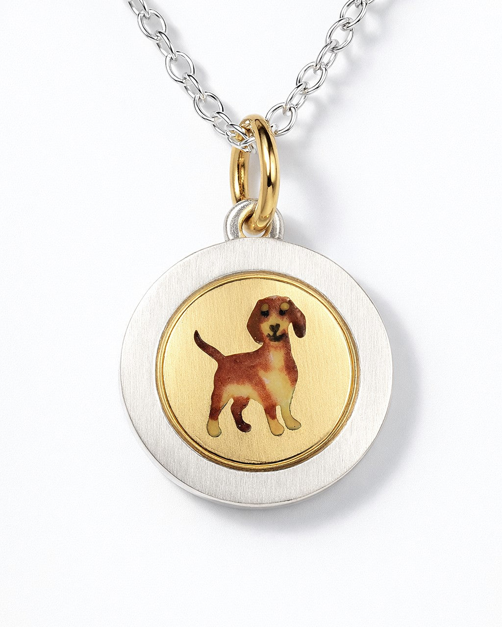 Enamel Dachshund on an 18ct gold disk in a silver pendant mount