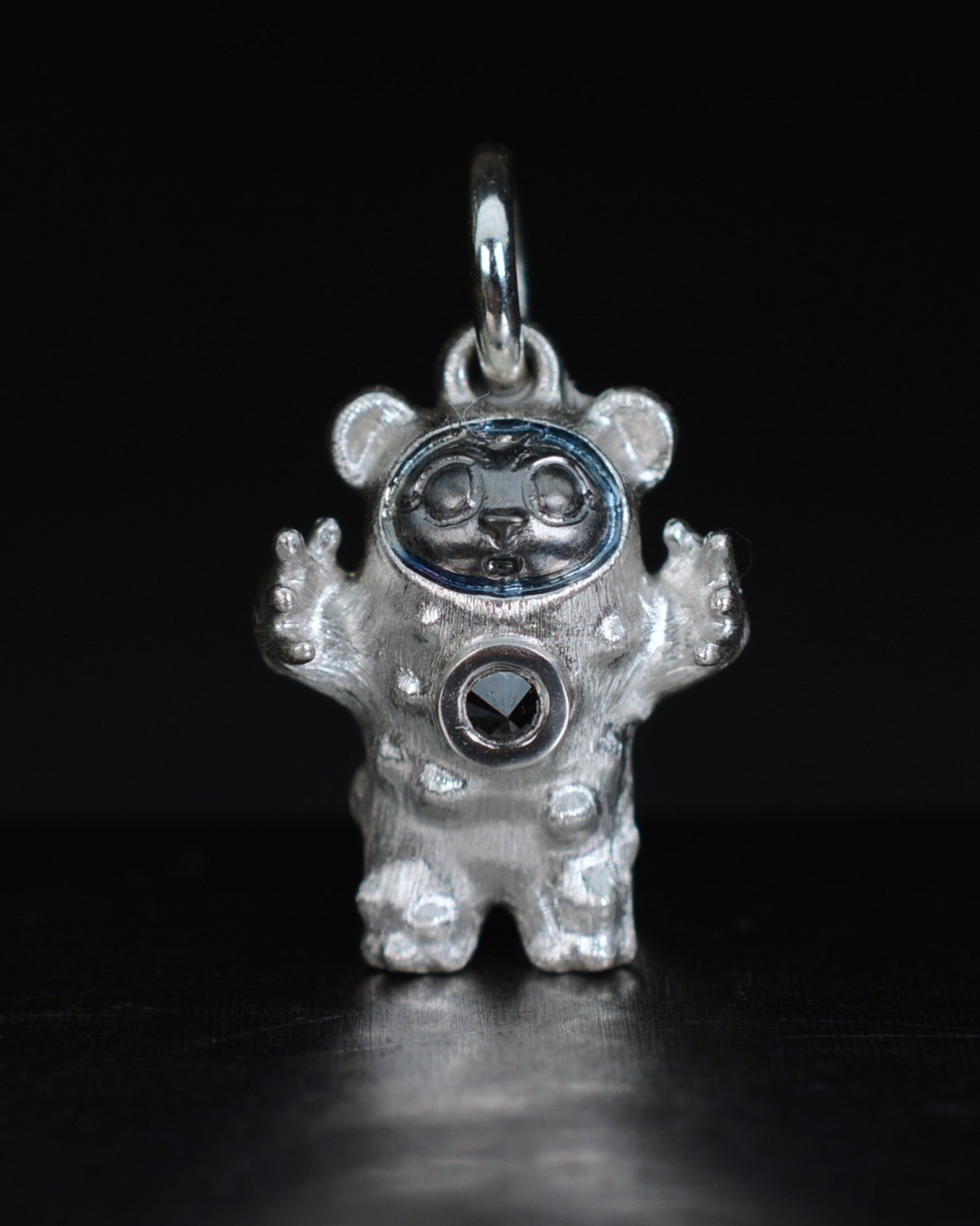 De Bears Cub Bright Creature with a black diamond and a black rhodium face.