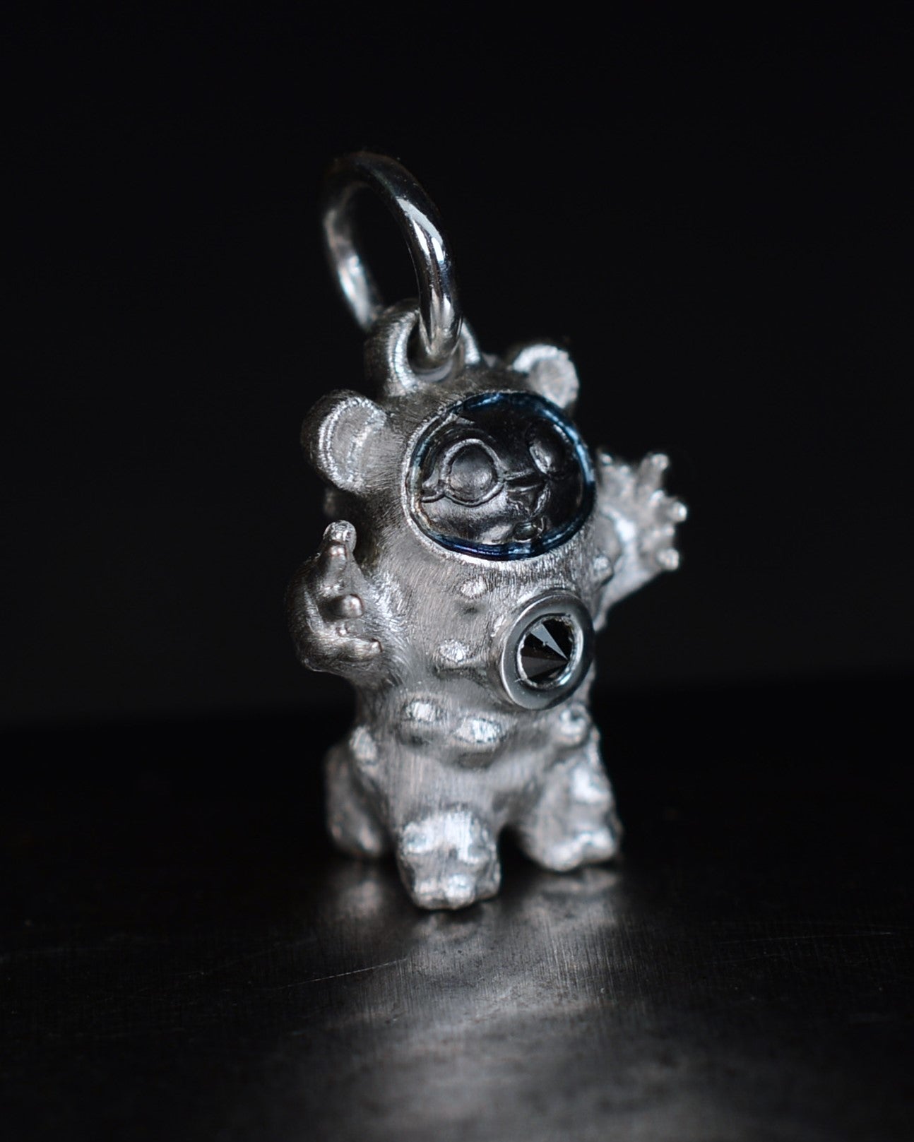 De Bears Cub Bright Creature with a black diamond and a black rhodium face.