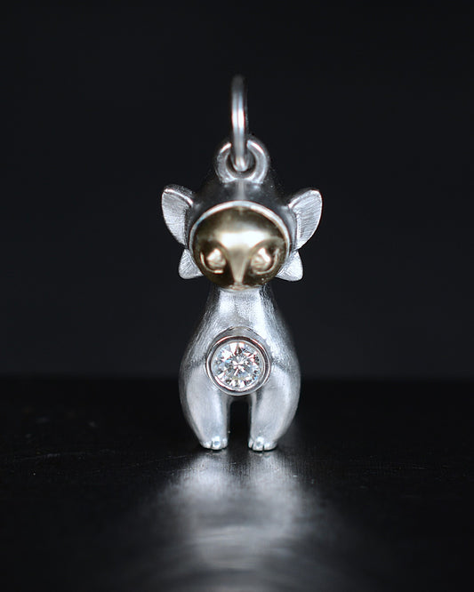 Art Deco Bright Creature with a gold face, set with a natural diamond.
