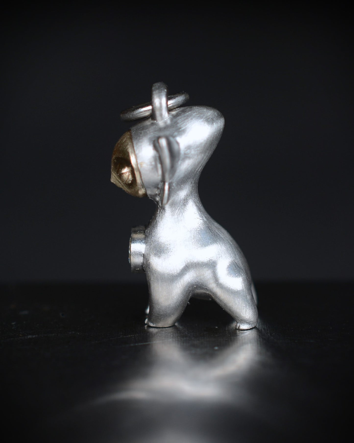 Art Deco Bright Creature with a gold face, set with a natural diamond.