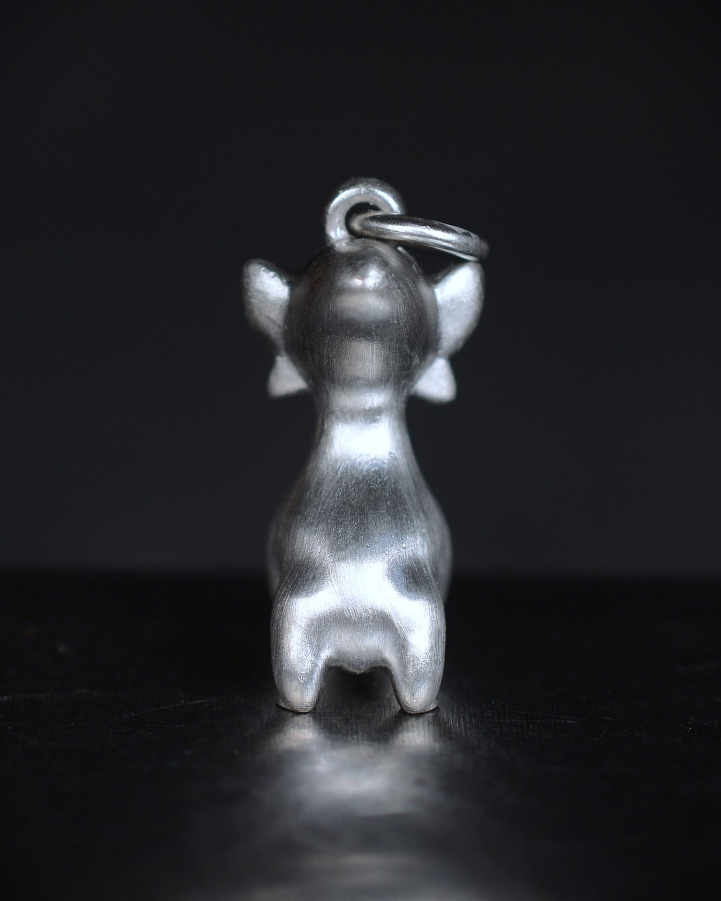 Art Deco Bright Creature with a gold face, set with a natural diamond.