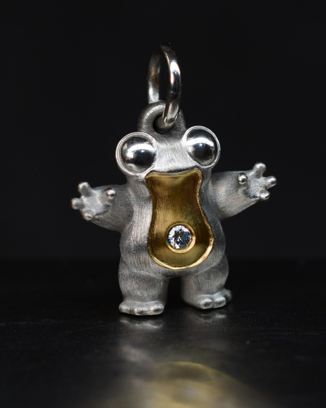 Small frog type Bright Creature with a diamond and parcel gilt.
