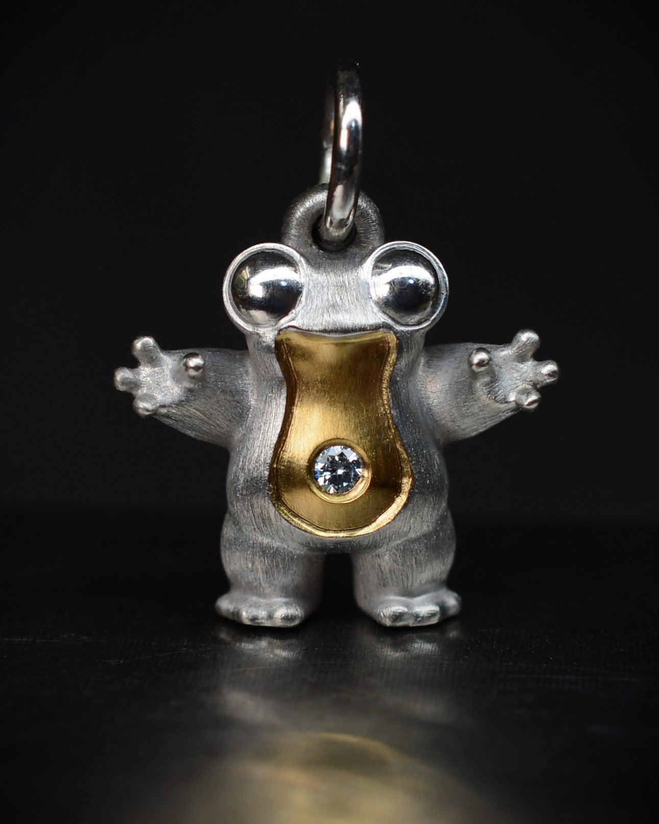 Small frog type Bright Creature with a diamond and parcel gilt.