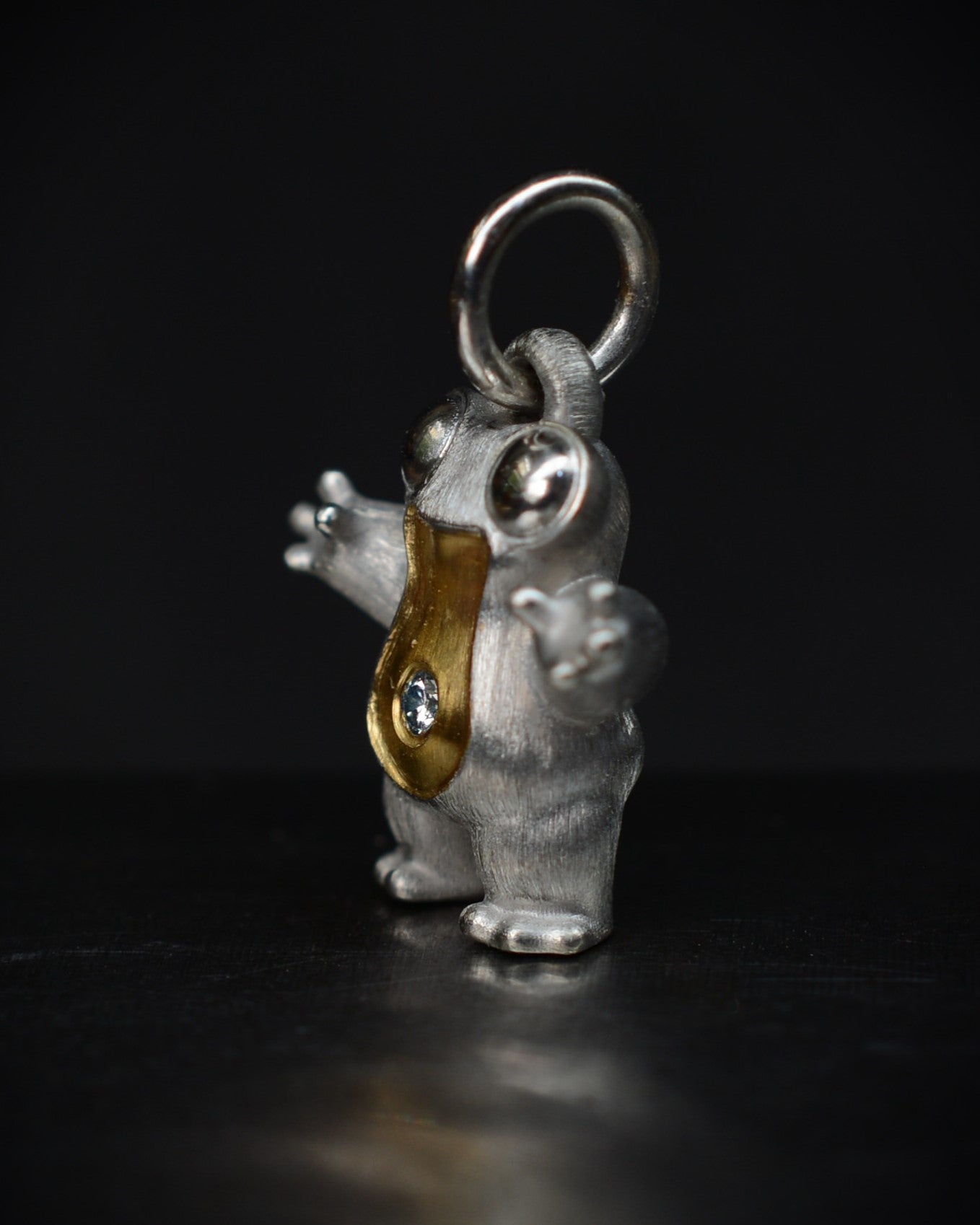 Small frog type Bright Creature with a diamond and parcel gilt.