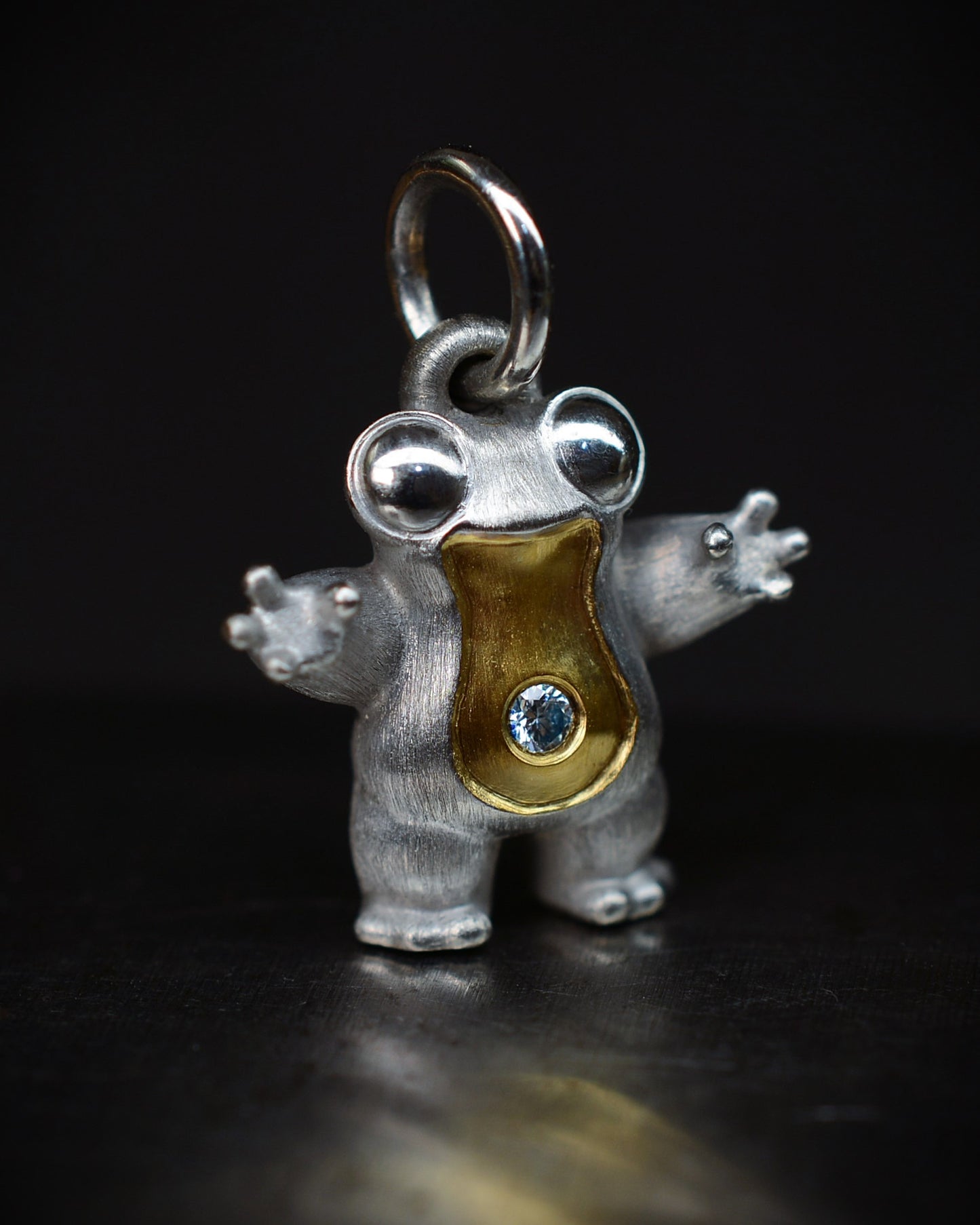 Small frog type Bright Creature with a diamond and parcel gilt.