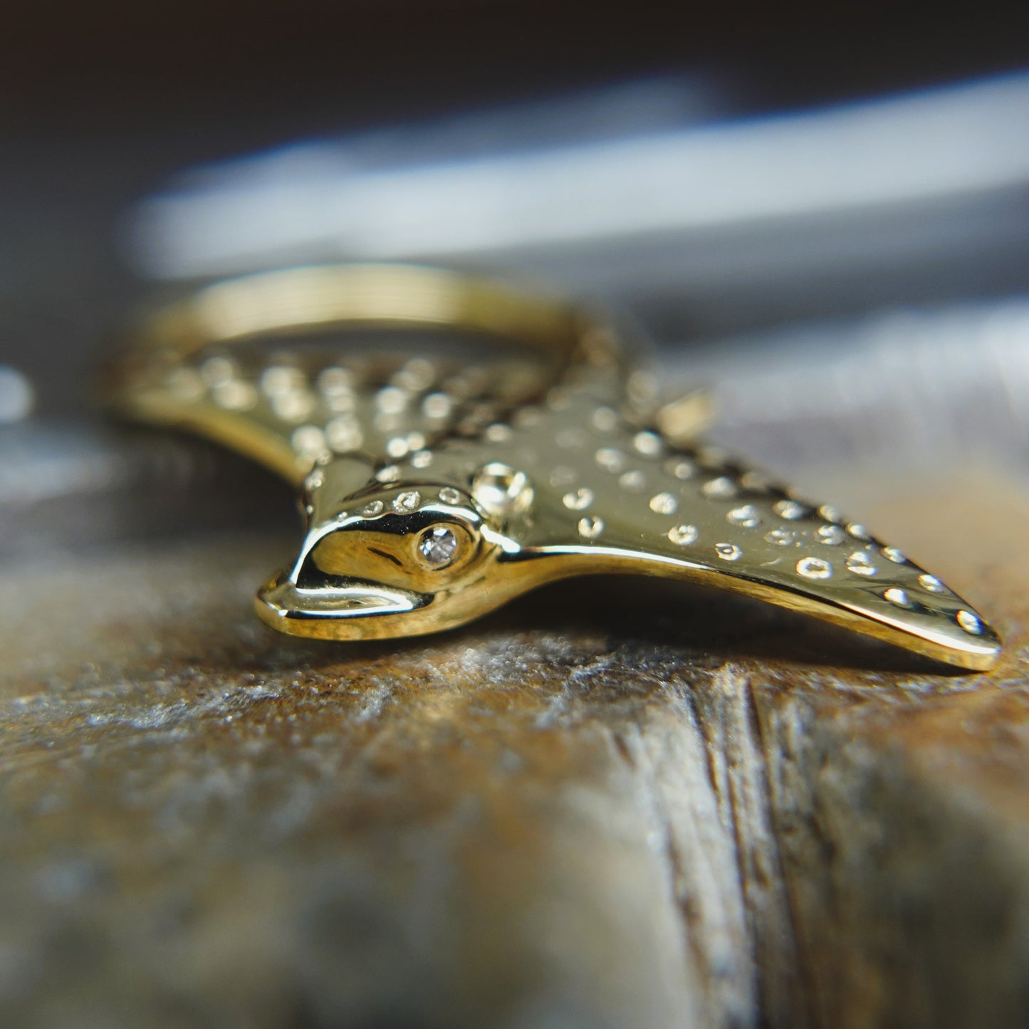 Gold Eagle Ray necklace. Double sided, solid gold pendant set with diamond eyes. Handmade to order. © Adrian Ashley