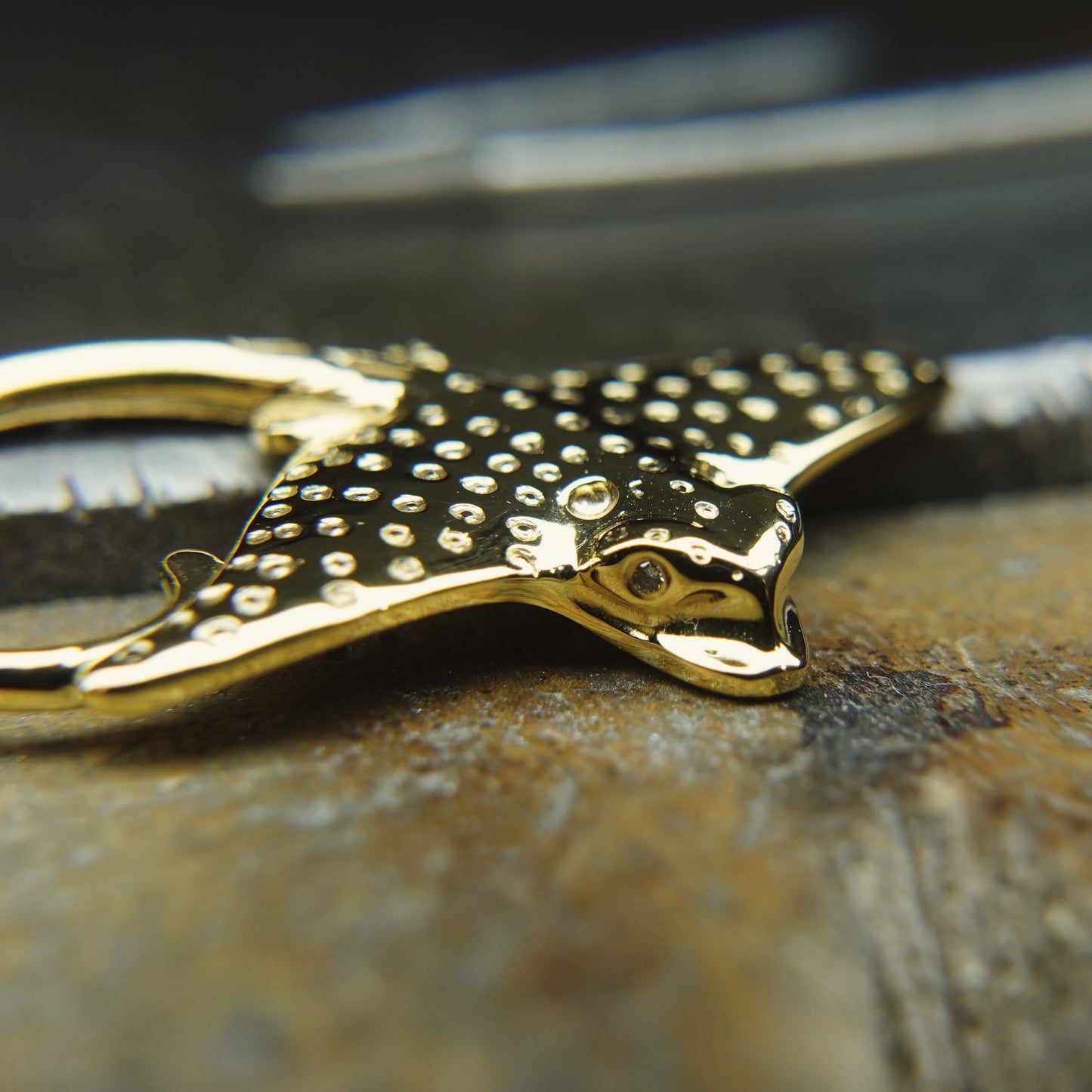 Gold Eagle Ray necklace. Double sided, solid gold pendant set with diamond eyes. Handmade to order. © Adrian Ashley