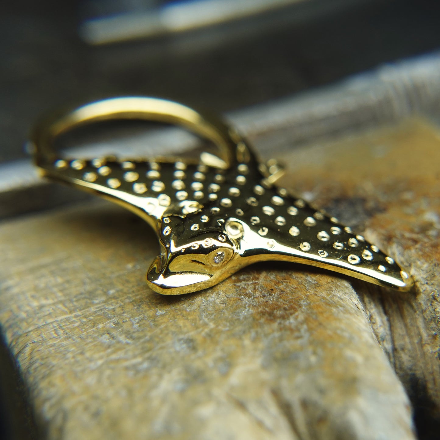 Gold Eagle Ray necklace. Double sided, solid gold pendant set with diamond eyes. Handmade to order. © Adrian Ashley