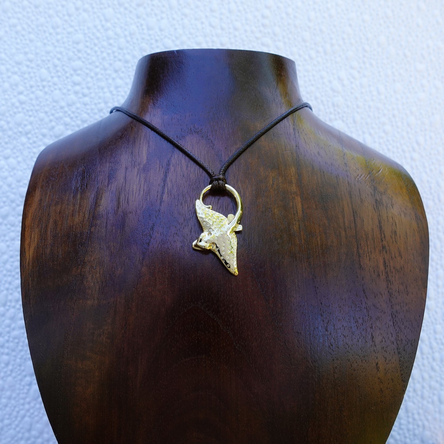 Gold Eagle Ray necklace. Double sided, solid gold pendant set with diamond eyes. Handmade to order. © Adrian Ashley