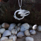 Falcon necklace. Made from highly polished, tarnish resistant silver, hung on a solid silver chain. © Adrian Ashley