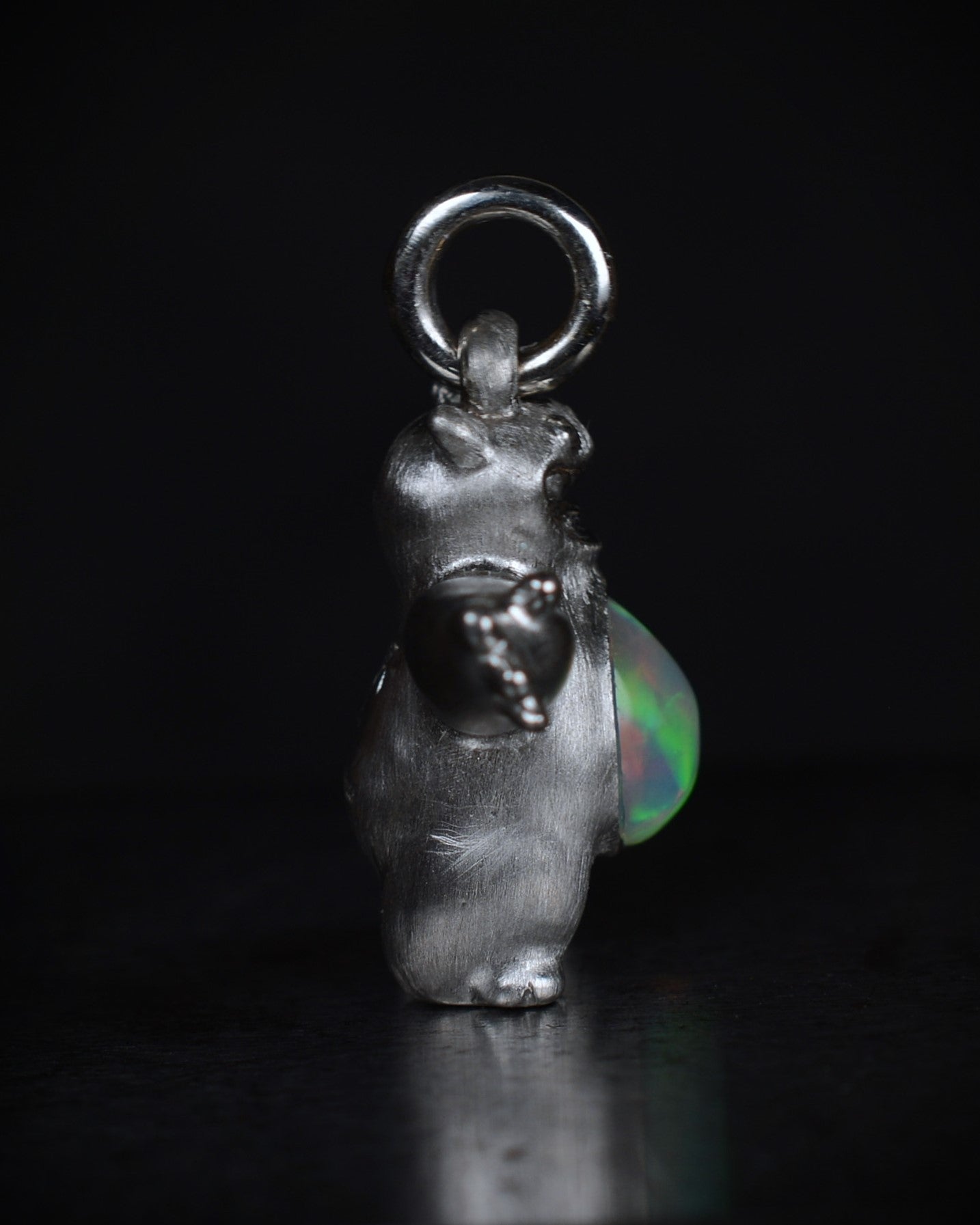 Happy chubby Bright Creature Companion Being with a jelly opal belly.