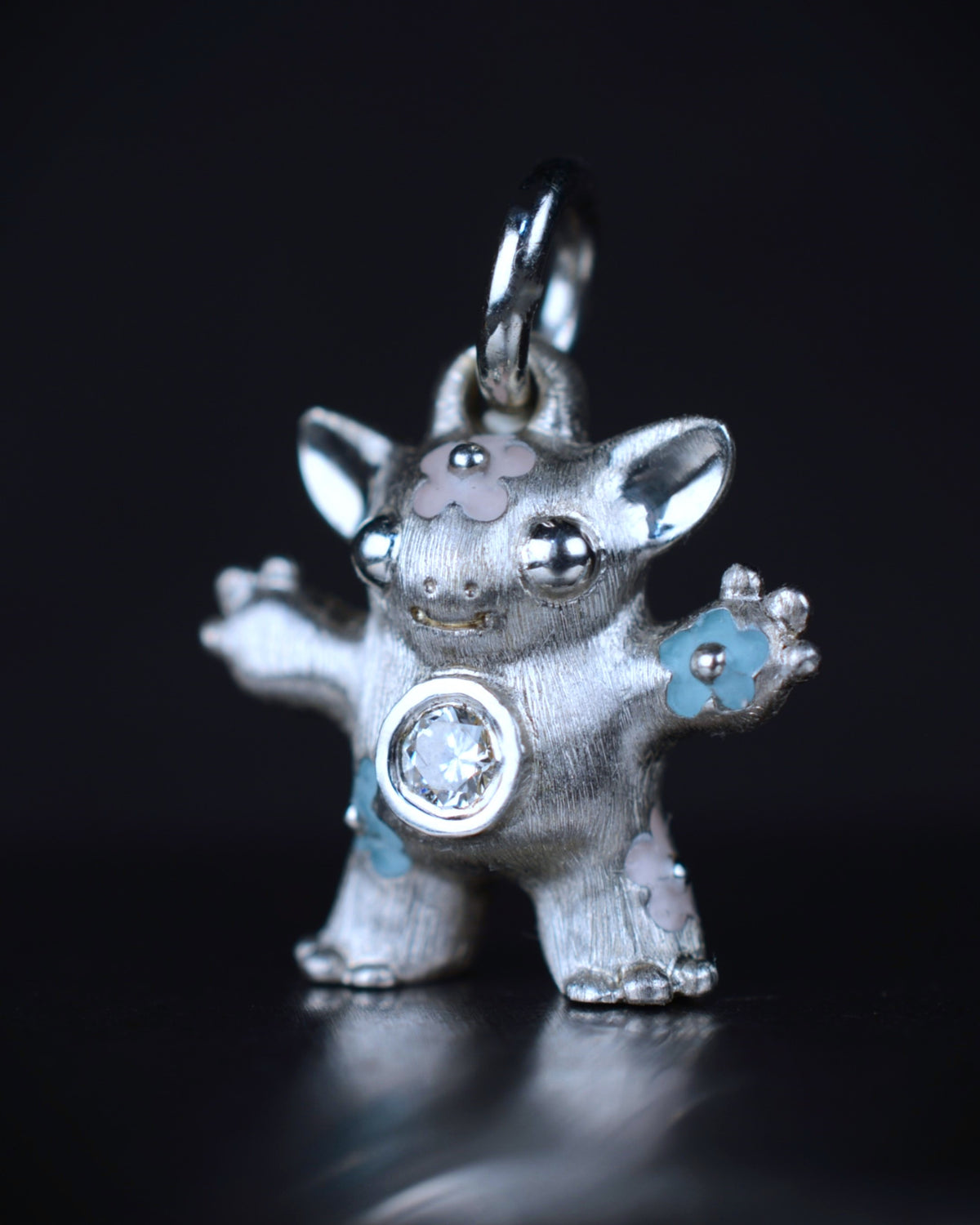 Flower Girl Creature set with a natural diamond.