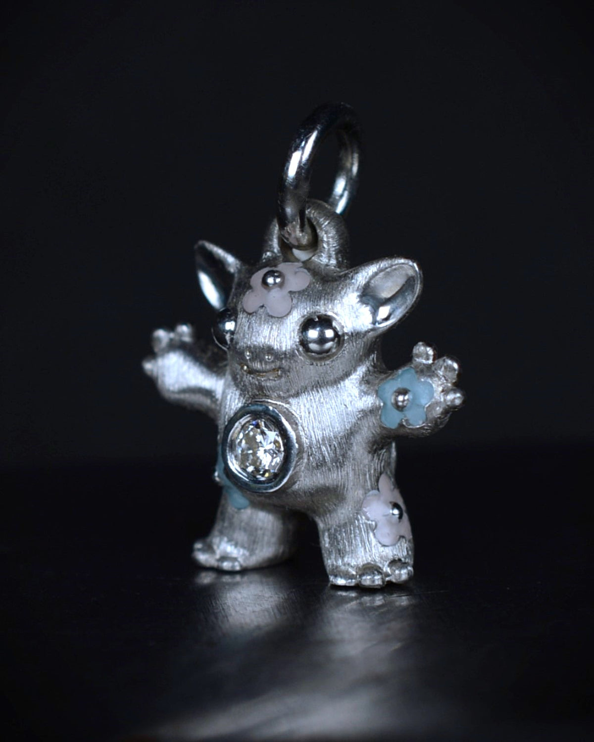 Flower Girl Creature set with a natural diamond.