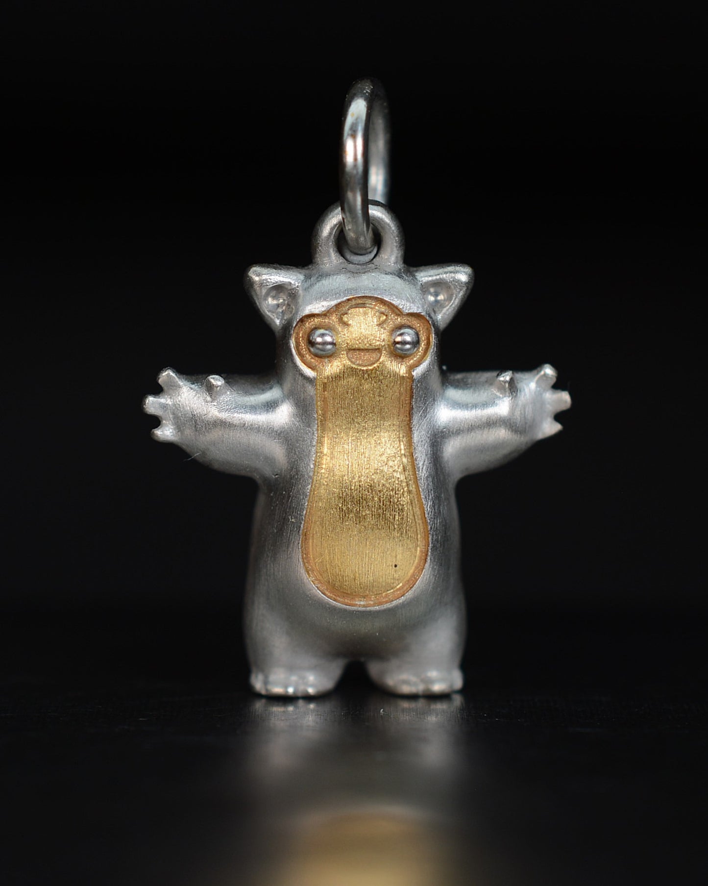 Fox eared small pearshape Bright Creature with parcel gilt.