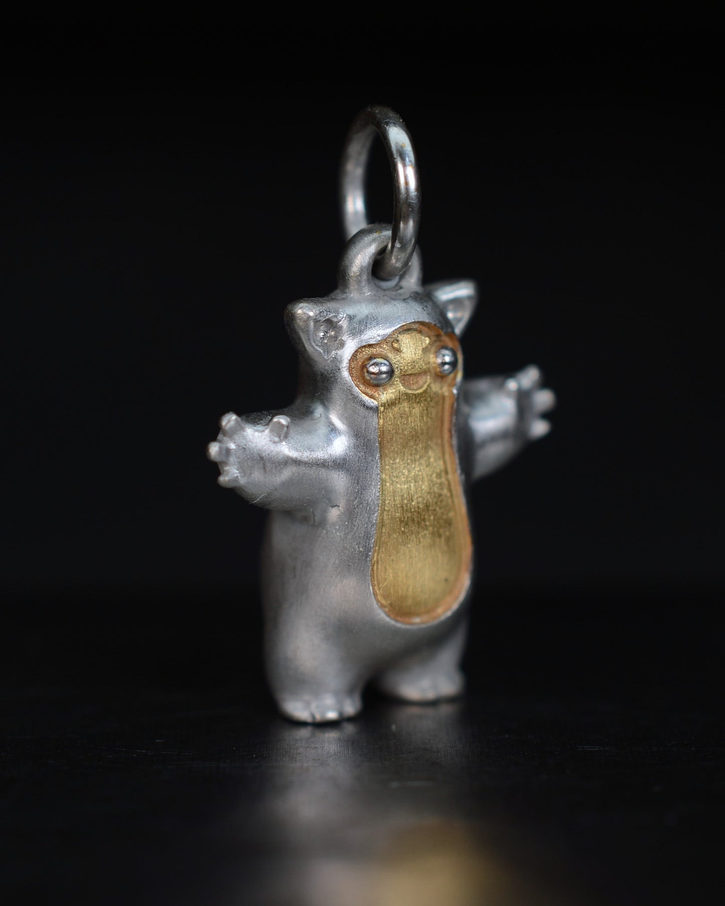 Fox eared small pearshape Bright Creature with parcel gilt.