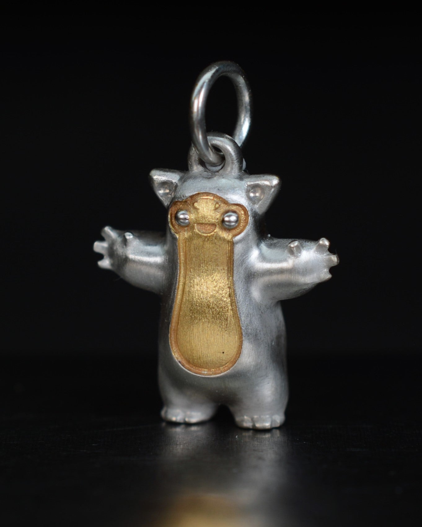 Fox eared small pearshape Bright Creature with parcel gilt.