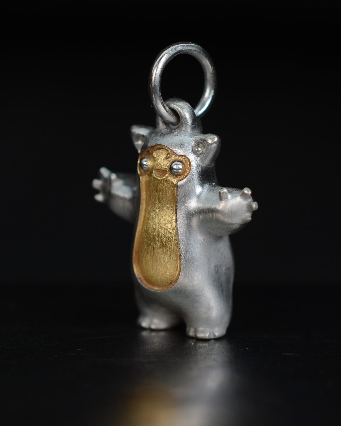 Fox eared small pearshape Bright Creature with parcel gilt.