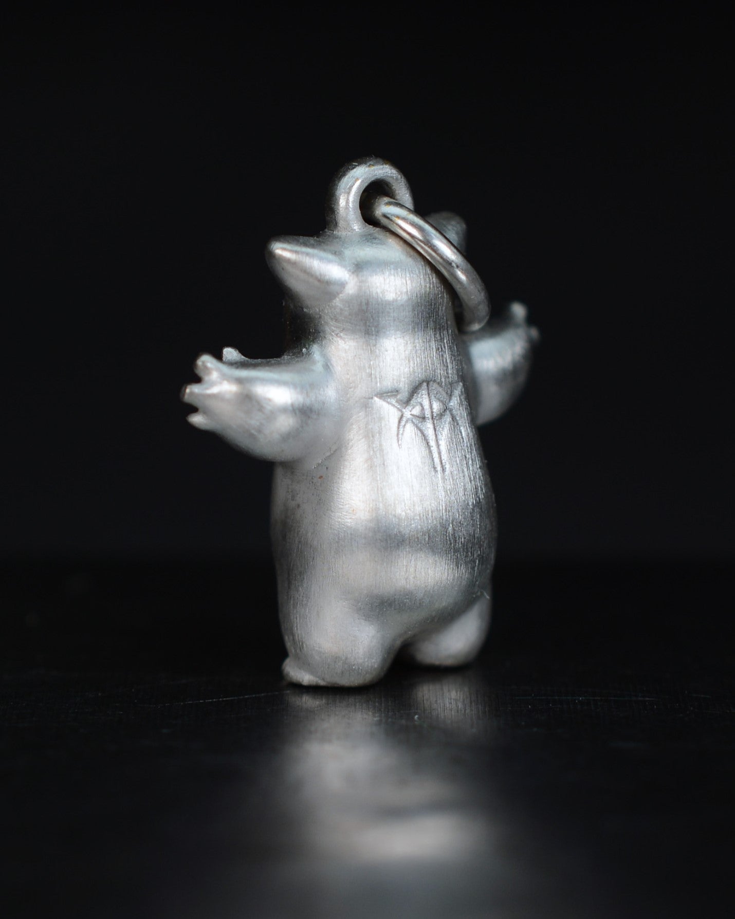 Fox eared small pearshape Bright Creature with parcel gilt.