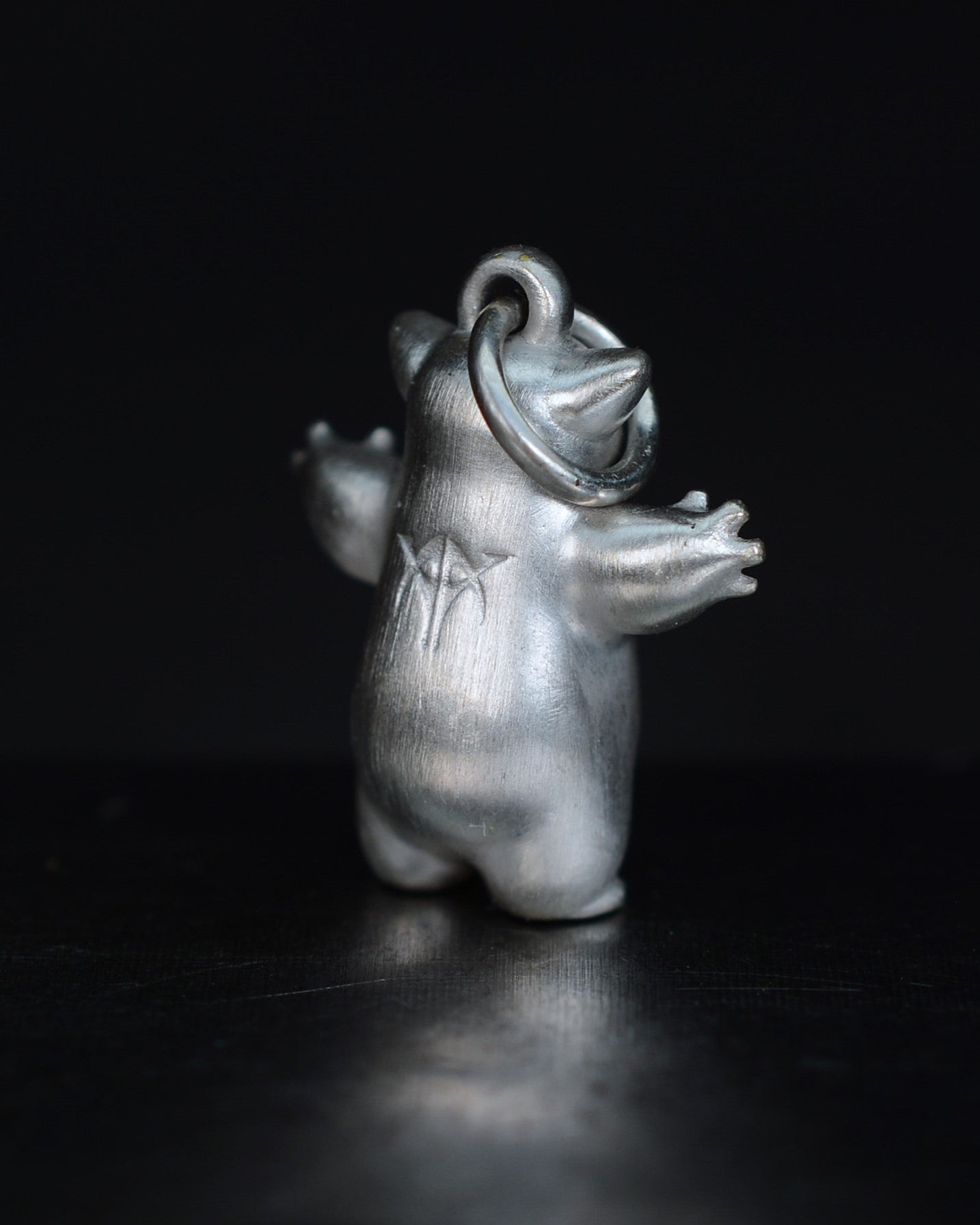 Fox eared small pearshape Bright Creature with parcel gilt.