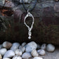 Freediver necklace. Made from highly polished, tarnish resistant silver, strung on a strong cord. © Adrian Ashley
